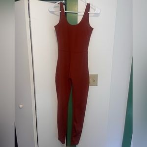 Girlfriend collective brown/ burnt orange unitard, gently used, size small